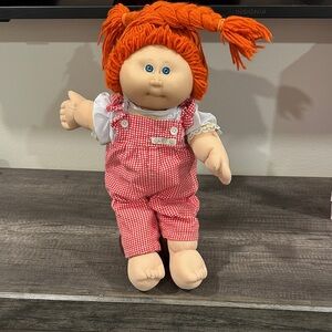 Cabbage Patch Kids Doll with Red Hair and Pink Outfit